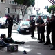 Several Los Angeles police officers stand with guns drawn over a homeless man who was reportedly shot some five to seven times March 1, 2015, during an altercation with police.
Youtube
